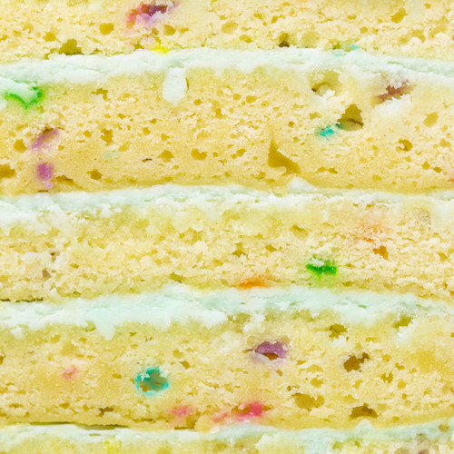 Close-up slice of Vanilla Celebration Cake moist vanilla sponge colorful confetti view 3