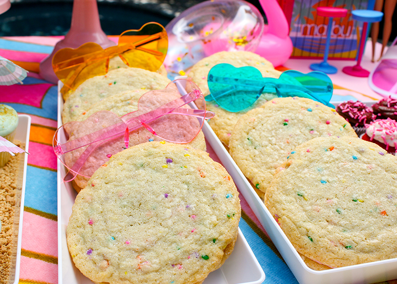 Snickerdoodle Sandwiches on a platter with sunglasses laid on top